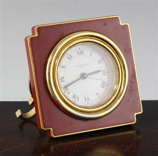 A Cartier of Paris enamelled gilt metal travelling timepiece, 3in.